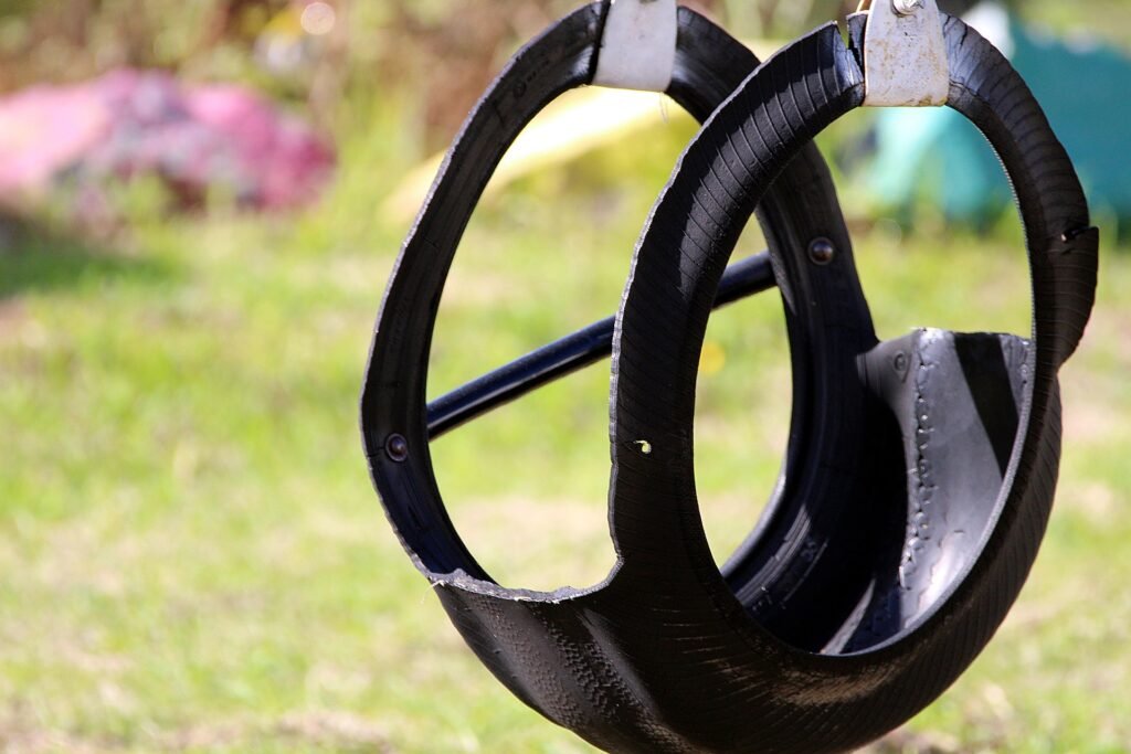 old tire swing on backyard